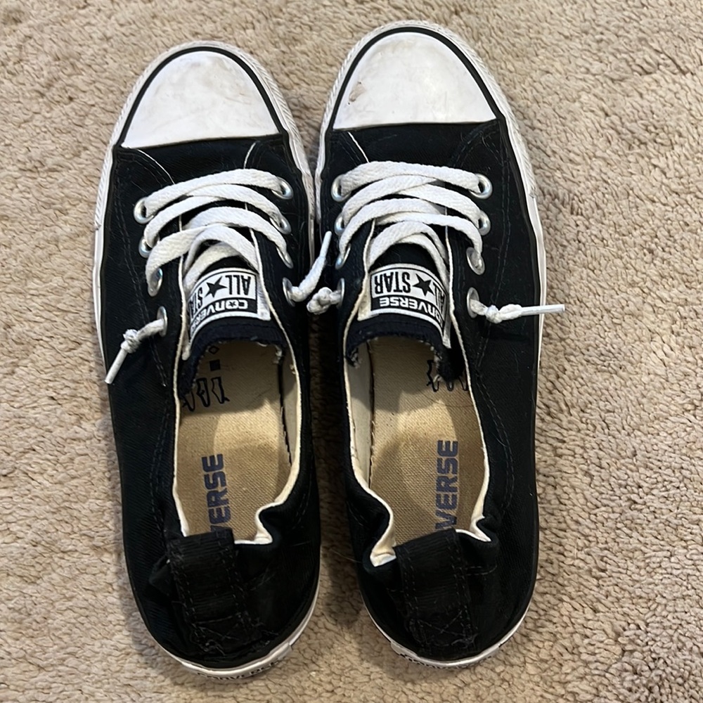 Black converse. Note staining and scuff marks in photos